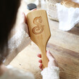 Lisa Angel Square Personalised Initial Bamboo Hairbrush Held by Model