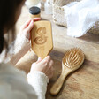Lisa Angel Personalised Initial Bamboo Hairbrush Held by Model
