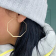 Model Wearing Delicate Octagonal Hoop Earrings in Gold