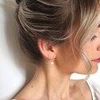 Model Wearing Lisa Angel Gold Birthstone Huggie Hoop Earrings