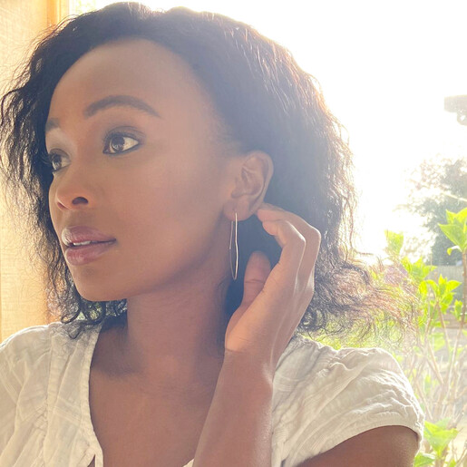 Model Wearing Lisa Angel Large Thin Heart Hoop Earrings in Sterling Silver