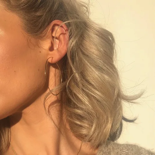 Model Wearing Ladies' Large Thin Hoop Earrings in Gold Sterling Silver