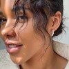 Model wears Lisa Angel Silver Pearl Edge Hoop Stud Earrings