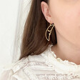Model Wearing Lisa Angel Ladies' Sleeping Crescent Moon Face Drop Earrings in Gold