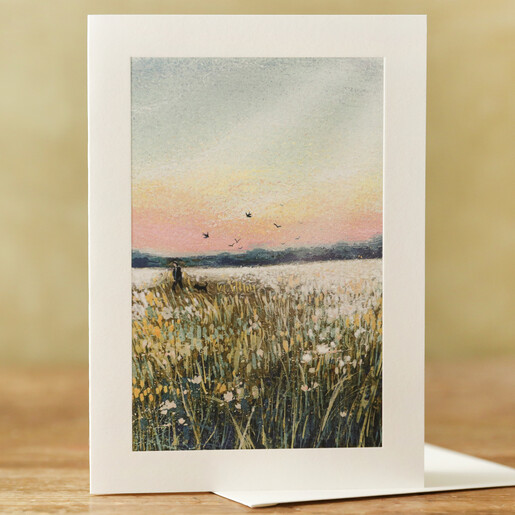 Dog Walking At Dusk Greeting Card on Table