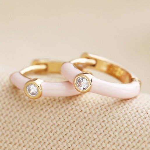 Blush Pink Enamel Crystal Huggie Hoop Earrings in Gold on Beige Fabric