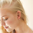 Blush Pink Enamel Crystal Huggie Hoop Earrings in Gold on Model