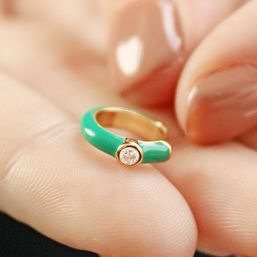 Model Holding Emerald Green Crystal Enamel Ear Cuff in Gold