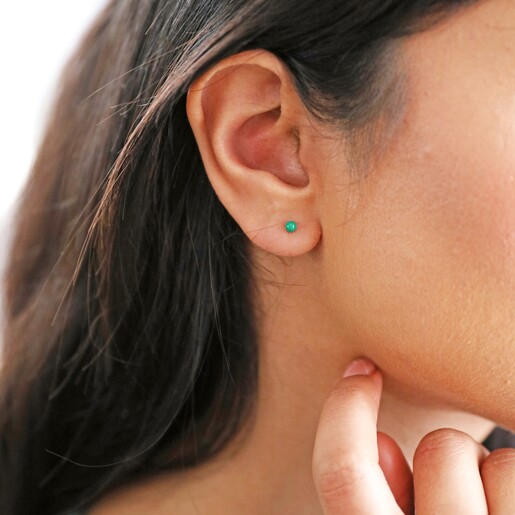 model wearing Green Ball Stud Earrings in Gold