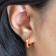 Orange Enamel Crystal Huggie Hoop Earrings in Gold on Model