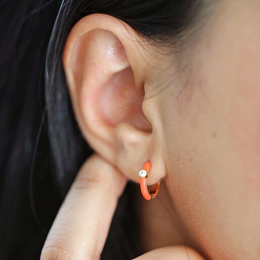 Model Wearing Orange Enamel Crystal Huggie Hoop Earrings in Gold