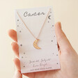 Constellation Moon Necklace in Rose Gold Cancer Held by Model