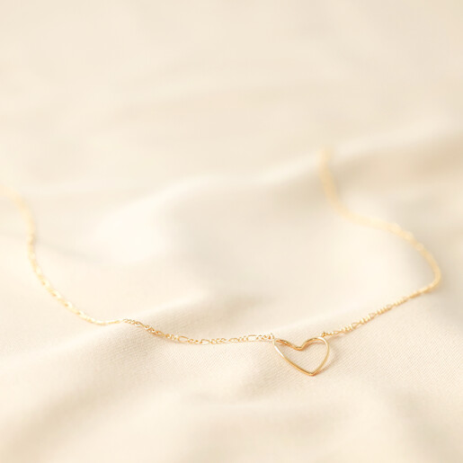 Full Length Figaro Chain and Heart Outline Necklace in Gold on fabric