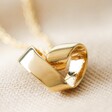 Close Up of Infinity Heart Knot Necklace in Gold