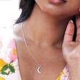 Close Up of Model Wearing Crystal Crescent Moon Necklace in Silver