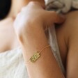 Model wearing the Gold Fortune Tarot Card Bracelet