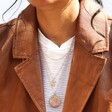 Model Wearing Hammered Initial Charm Necklace in Gold and Other Necklace