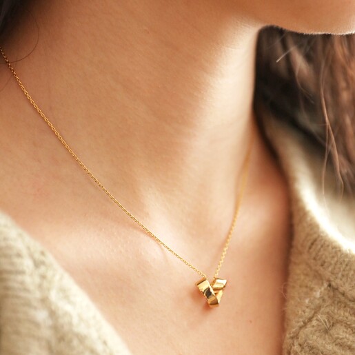 Close Up of Infinity Heart Knot Necklace in Gold