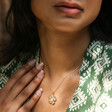 Model Wearing Large Flower Pendant Necklace with Pearl in Gold