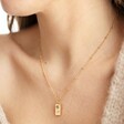 Model Wearing Gold Personalised Birth Flower Tiny Tag Pendant Necklace