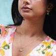 Model Wearing Small Flower Necklace with Pearl Centre in Gold