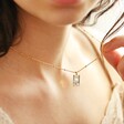 Tiny Hammered Tarot Card Pendant Necklace on Model