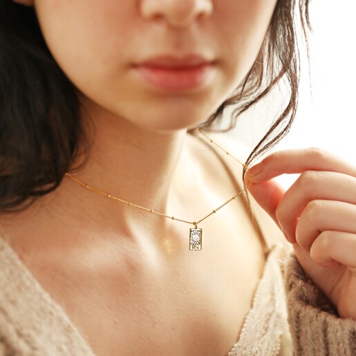 Model Holding Tiny Hammered Tarot Card Pendant Necklace