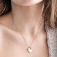 Personalised Tiny Pearl Initial and Heart Charm Necklace in Gold on Model