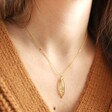 Model Wearing Pressed Yellow Flowers Pendant Necklace in Gold