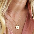 Close Up of Spinning Heart Pendant Necklace in Gold