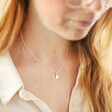 Model Wearing Smaller Silver Heart Necklace