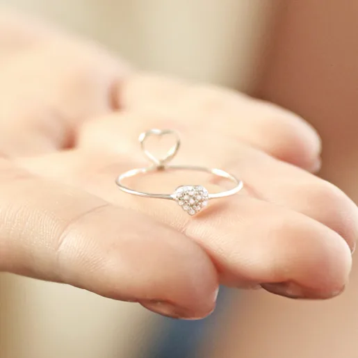 Model Holding Sterling Silver Hidden Heart Ring