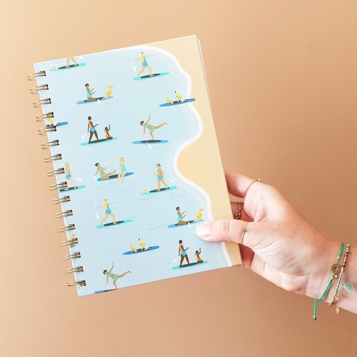 Model Holding Paddleboarding Notebook