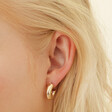 Model Wearing Big Metal London Pack Of 2 Hoop Earrings in Gold
