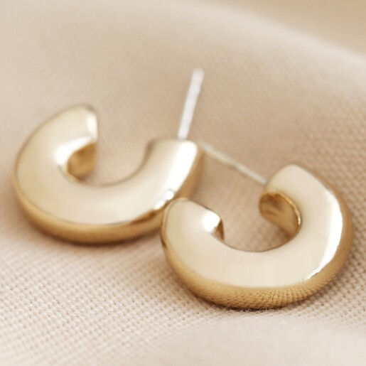 Gold Big Metal London Pack Of 2 Hoop Earrings on Beige Fabric