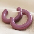 Close-up of Purple Model Wearing Gold Hoop Earrings