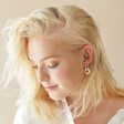 Model Wears Big Metal London Pearl Daisy Hoop Earrings in Silver