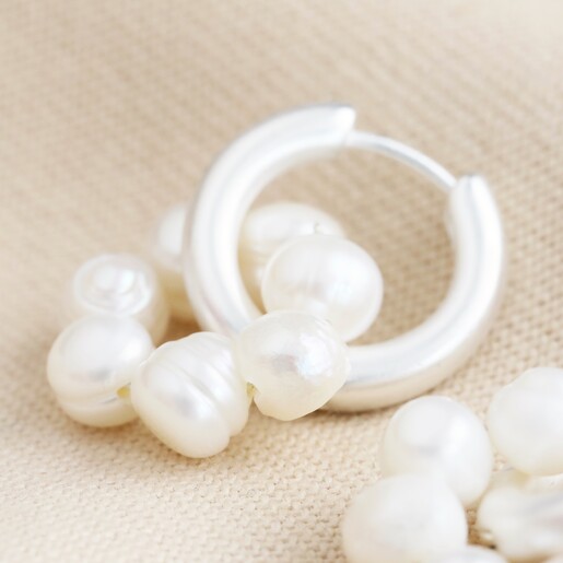 Close-up of Big Metal London Pearl Daisy Hoop Earrings in Silver