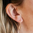Model Wearing Gemstone Charm Hoop Earrings in Gold