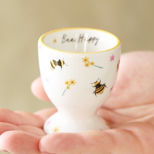 Model Holding Flowers and Bees Egg Cup