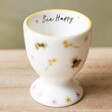 Flowers and Bees Egg Cup on Wooden Table