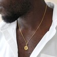 Male Model Wearing Spinning Disc Pendant Necklace in Gold