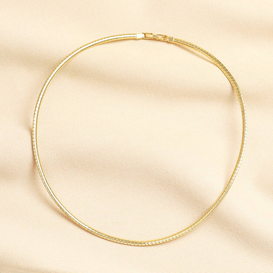 This sleek snake chain necklace is perfect for adding an interesting shine to a necklace stack