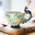 House of Disaster Luxe Peacock Mug on Chopping Board