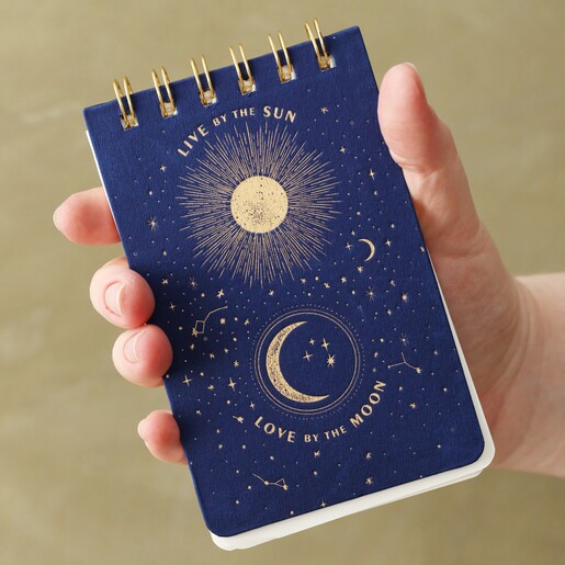 Model Holding Live By The Sun Celestial Flip Notebook