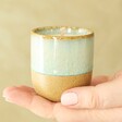 Paddywax Matcha Tea and Bergamot Glaze Ceramic Candle in Model's Hand