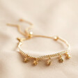 Estella Bartlett Woven Star Charm Bracelet in Gold on fabric