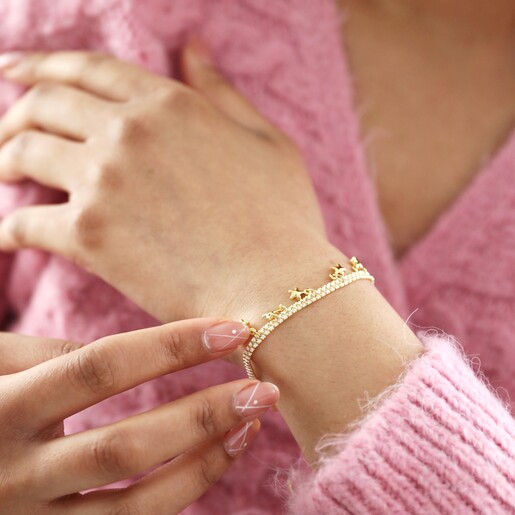 Model wearing Estella Bartlett Woven Star Charm Bracelet in Gold