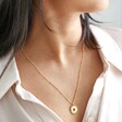 close up of Estella Bartlett Full Sunburst Necklace in Gold on model