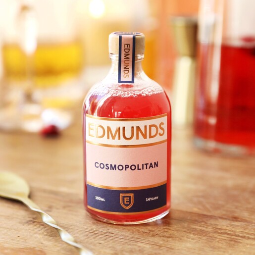 bottle of edmunds cocktails cosmopolitan on table